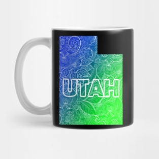 Colorful mandala art map of Utah with text in blue and green Mug